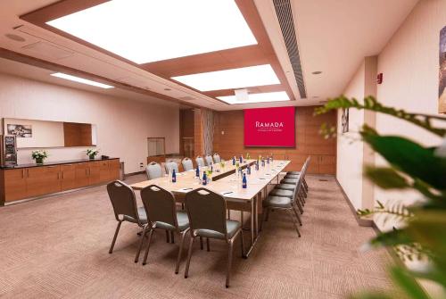 a conference room with a long table and chairs at Ramada Plaza By Wyndham Istanbul City Center in Istanbul