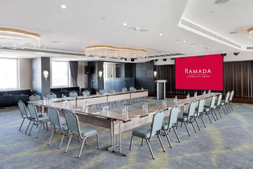 a large conference room with a long table and chairs at Ramada Plaza By Wyndham Istanbul City Center in Istanbul