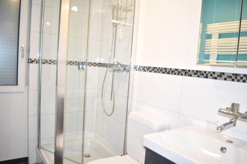 a bathroom with a shower and a sink at Gentiana (463 Li) 4-ZW in Valbella