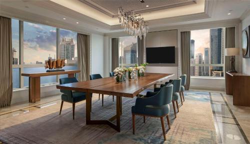 a dining room with a long table and chairs at Grand Hyatt Jakarta in Jakarta