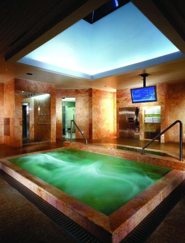 a large pool of green water in a room at Grand Hyatt Jakarta in Jakarta