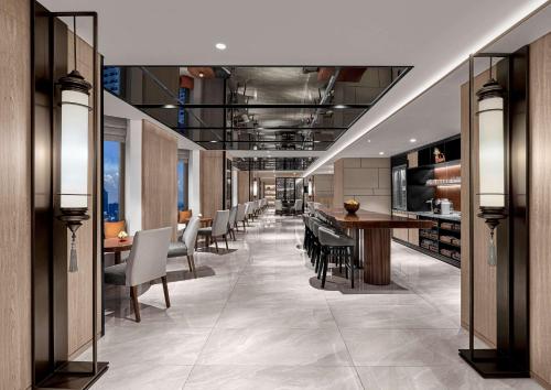 a dining room with a table and chairs at Grand Hyatt Jakarta in Jakarta