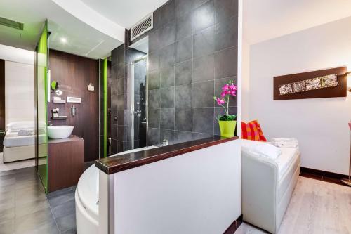 a bathroom with a toilet and a sink at Best Western Cinemusic Hotel in Rome