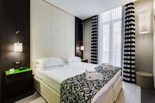 Postel nebo postele na pokoji v ubytování Best Western Cinemusic Hotel