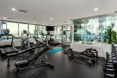 a gym with treadmills and ellipticals in a building at Ramada by Wyndham Dubai Barsha Heights in Dubai