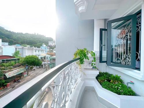 a balcony with a view of a city at Milanesa Hotel and Apartment in Vung Tau