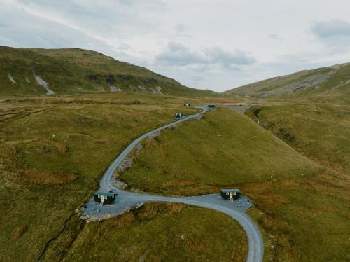 a winding road in the middle of a hill at Barlwyd Glamping in Blaenau-Ffestiniog