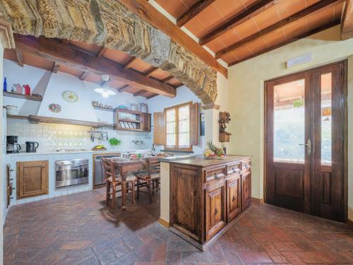 a kitchen with a table and a dining room at Holiday Home L'Aia by Interhome in Seravezza