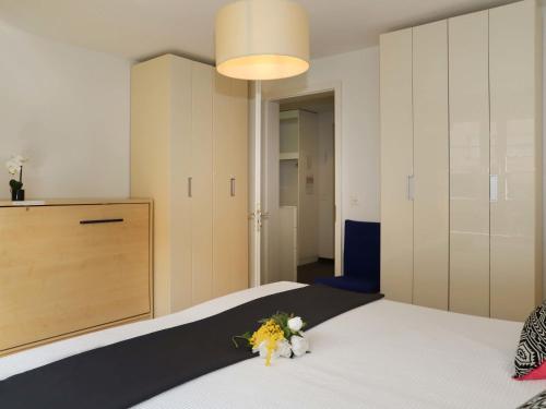 a bedroom with a bed with flowers on it at Apartment Mon Repos by Interhome in Davos