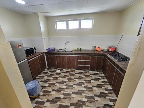 Η κουζίνα ή μικρή κουζίνα στο Newly refurbished Cozy PD Bayview Apartment with Ocean View