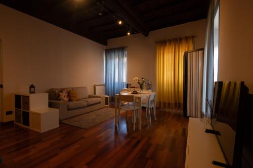 a living room with a couch and a table at La Casa del Palio in Ronciglione