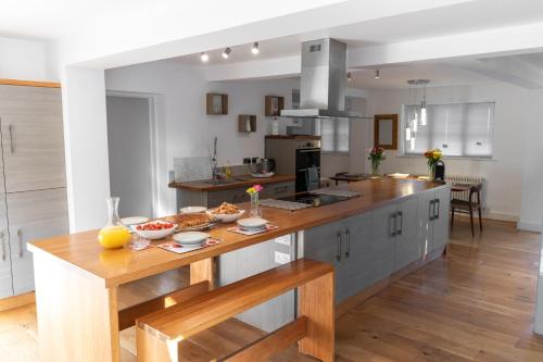a kitchen with a table with food on it at Executive High-End Luxury Accommodation in Southampton, Perfect for Relocators, Contractors and Professionals in Southampton