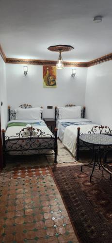 Postel nebo postele na pokoji v ubytování Riad Royal