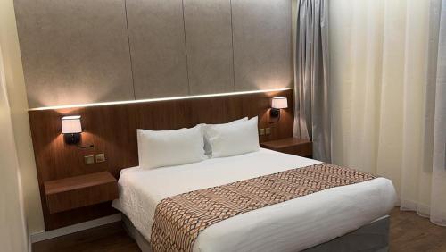 En eller flere senge i et værelse på فندق بيري الندوة