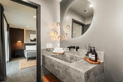 a bathroom with a sink and a mirror at Desert Oasis in Joshua Tree