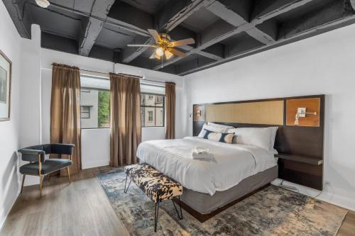 a bedroom with a large bed and a ceiling fan at House at Phipps in Atlanta
