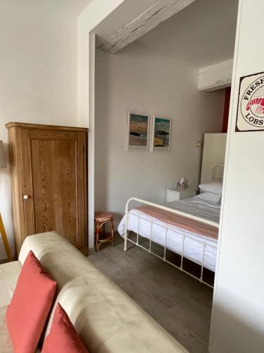 Ένα ή περισσότερα κρεβάτια σε δωμάτιο στο Appartement au Port