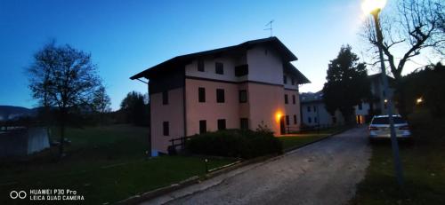 a house on the side of a road at Casa Costa - Residenze Bucaneve in Tonezza del Cimone