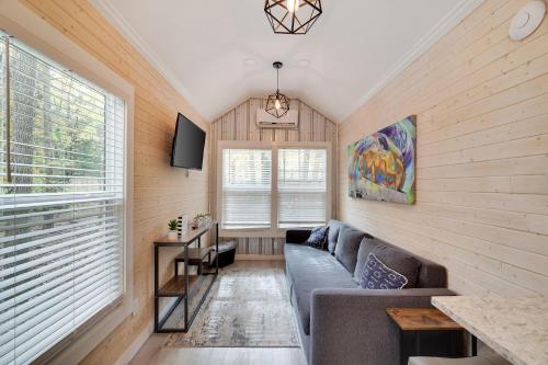 a living room with a couch and a tv at Camptel Poconos in Albrightsville