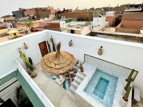 a view from the balcony of a house with a swimming pool at RIAD ILYM - Riad privatif Marrakech Medina in Marrakesh