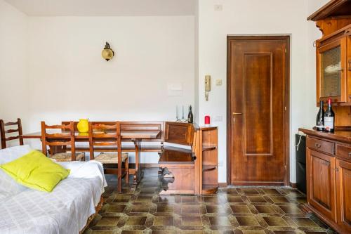 a bedroom with a desk and a bed and a table at Valsassina Paradise Apartment in Cassina Valsassina