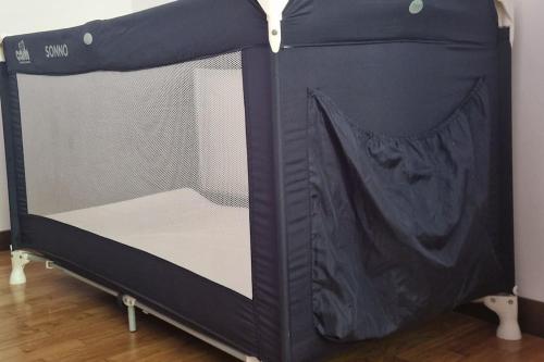 a black bunk bed with the door open at Valsassina Paradise Apartment in Cassina Valsassina