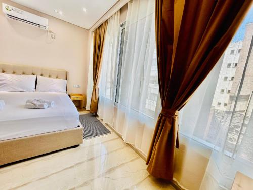 Postel nebo postele na pokoji v ubytování PORT TWINS SUITES No1