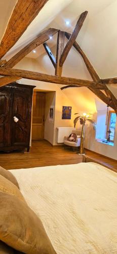 Ένα ή περισσότερα κρεβάτια σε δωμάτιο στο Le Clos de la Belle Loge Location de studio