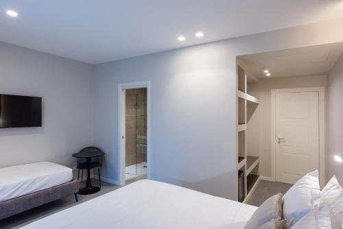 a bedroom with two beds and a mirror at Il Pumo - Apulian Rooms Bari Savoia in Bari