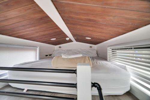 a bedroom with a large bed with a wooden ceiling at Camptel Poconos in Albrightsville