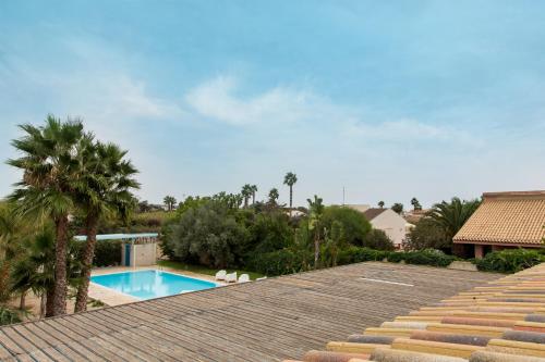 a view of a swimming pool from the roof of a house at Villa Dafne in Villaggio Azzurro