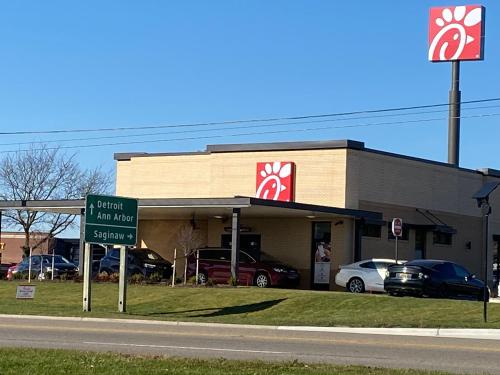 a krispy kreme store on the side of the road at Days Inn by Wyndham Flint/Bishop International Airport in Flint