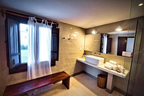 a bathroom with a sink and a mirror at Finca Valentina in El Encón