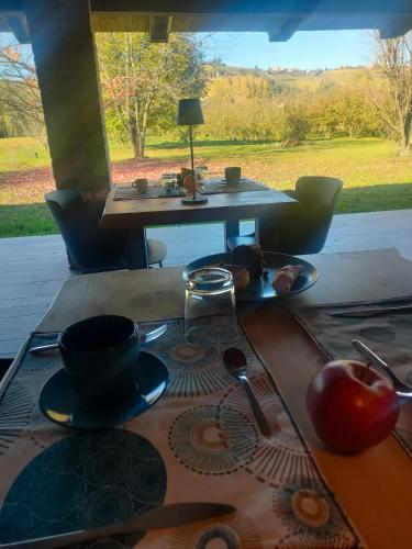 a table with a plate of food on top of it at Miravigne House - Casa di Campagna con Cucina in Castagnole Lanze