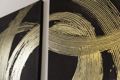 a book with a painting of a swirl at Comfy Stay 1 Bedroom Apartment in Rugby