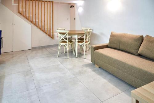 a living room with a couch and a table at Madama B&B in Gaeta