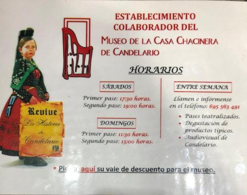 a menu for a restaurant with a picture of a girl and a chair at NovaCand in Candelario