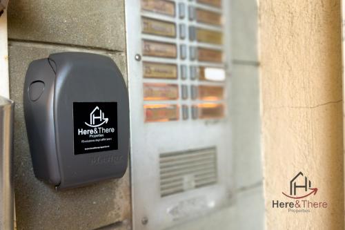 a metal mailbox on the side of a building at Beaches 1 min away - Free WiFi - Smart TV - AC in Albisola Superiore