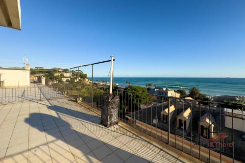 a balcony with a view of the beach at Beaches 1 min away - Free WiFi - Smart TV - AC in Albisola Superiore