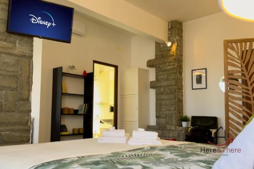 a bedroom with a bed with towels on it at Beaches 1 min away - Free WiFi - Smart TV - AC in Albisola Superiore