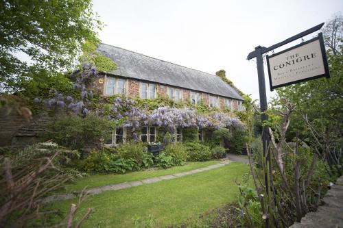 a building with a sign in front of it at The Conigre in Melksham