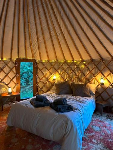 a bedroom with a bed in a yurt at The Yurt @ Penbanc Pasture in Cardigan