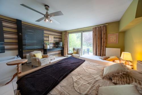 Postel nebo postele na pokoji v ubytování Guesthouse De Witte Merel Deluxe