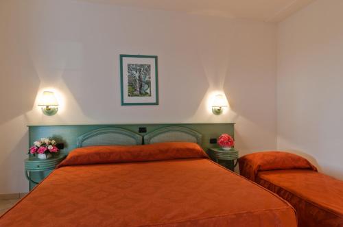 Ένα ή περισσότερα κρεβάτια σε δωμάτιο στο Agriturismo Al Parco Lecce