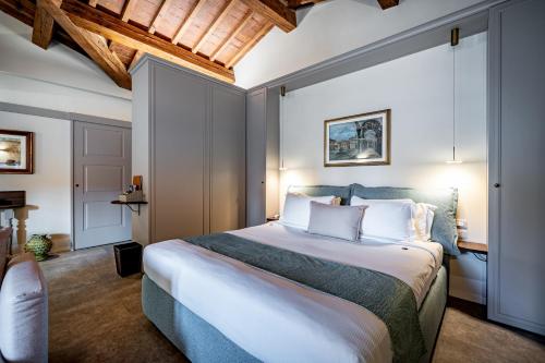 a bedroom with a large bed in a room at Dimora Collection - Le Torri - Boutique Luxury Suites - Adults Only in Florence