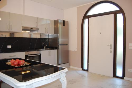 Kuchyň nebo kuchyňský kout v ubytování La Chiocciola Apartments