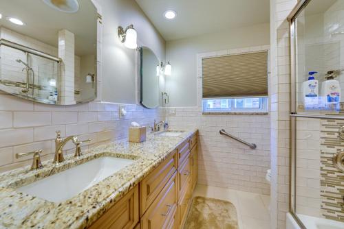 a bathroom with a sink and a mirror at Canal-Front Clay Township Gem Boat and Jet Ski Lift 