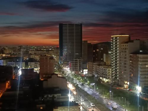 a city lit up at night with traffic at Résidence kadicia oran in Oran