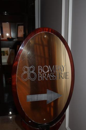 a sign with an arrow pointing to a berry preserve at Luxury Residence at Taj Cape Town - Top Corner Apartment with Balcony in Cape Town