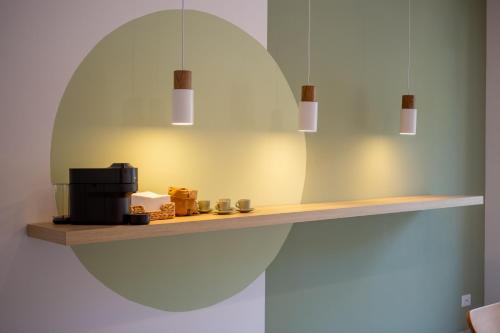 a shelf with a mirror and a microwave on it at 633 APPIA DESIGN ROOM in Rome